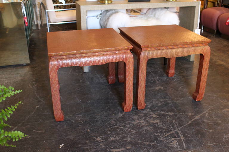 Asian style side tables, wrapped in a red-orange lacquered linen.