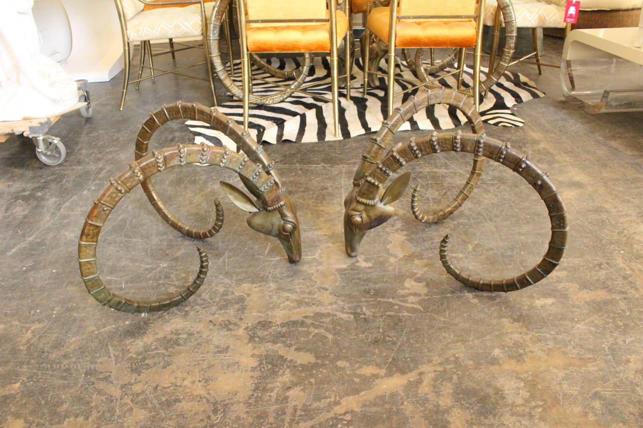 Pair Bronze Rams Head Coffee Table Base. Glass top not included.

dimensions: 24