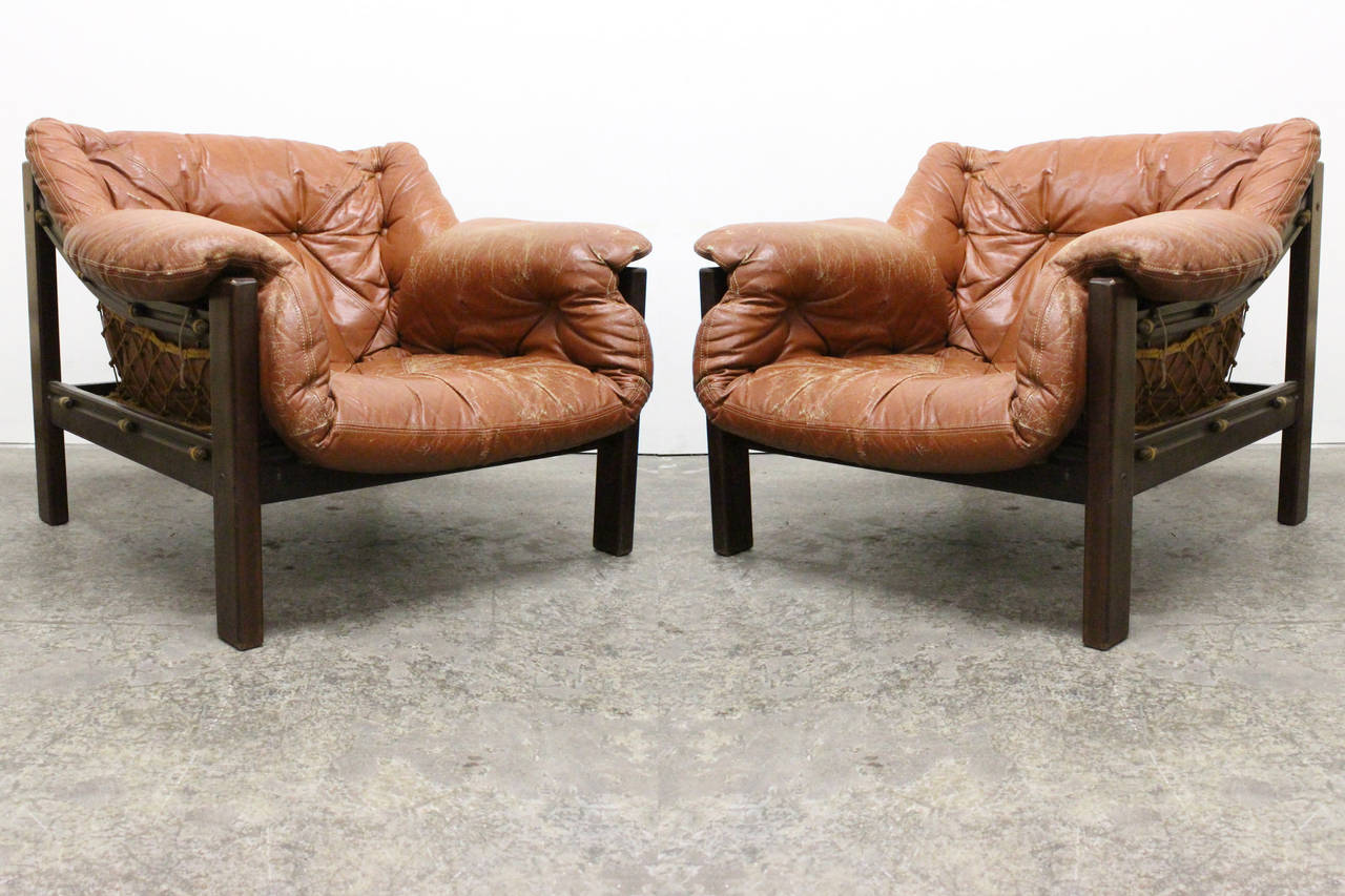 Pair Jean Gillon Sling Lounge chairs and Ottomans. 

dimensions: 33