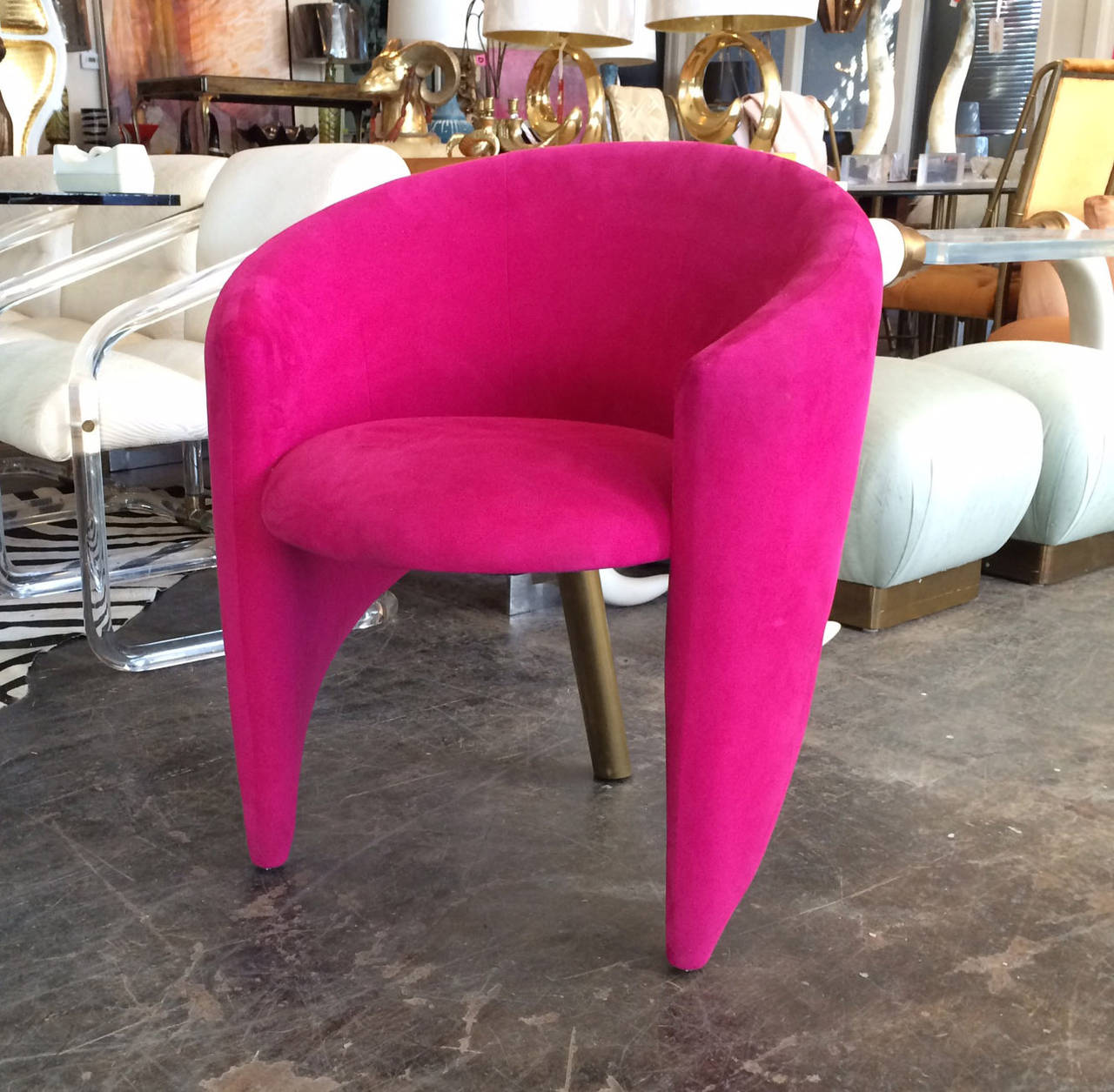Very sculptural 3 legged chairs in the style of Kelly Wearstler. This pair of chairs are upholstered in hot pink and are accented with a brass legs. The upholstery is in good vintage condition with minor fabric issues for age and use

dimensions: