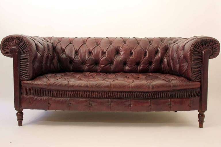 A fantastic late 19th century red leather chesterfield sofa with it`s original upholstery in exceptional condition (no rips or tears).