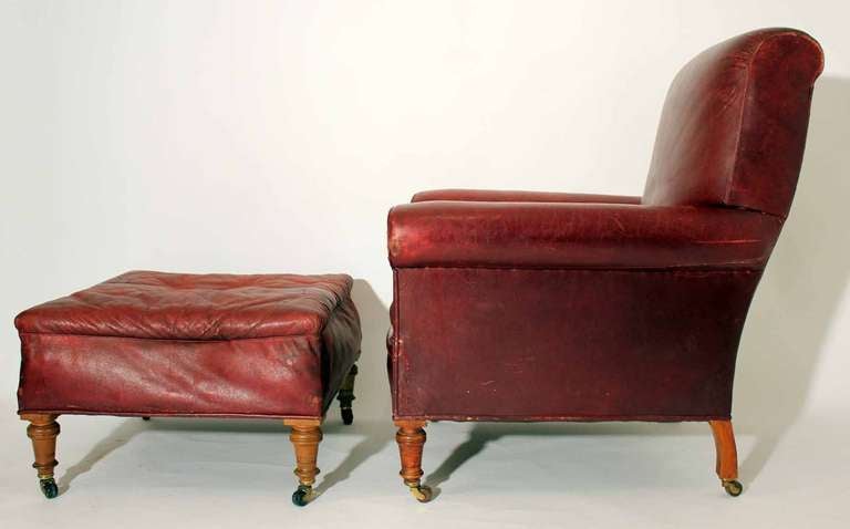 A very large and  rare late 19th century red Moroccan leather gentlemans` armchair with matching footstool, in the manner of Hampton & CO London. 

Condition: 
It is rare to find a chair of this age and pedigree with a matching footstool in such