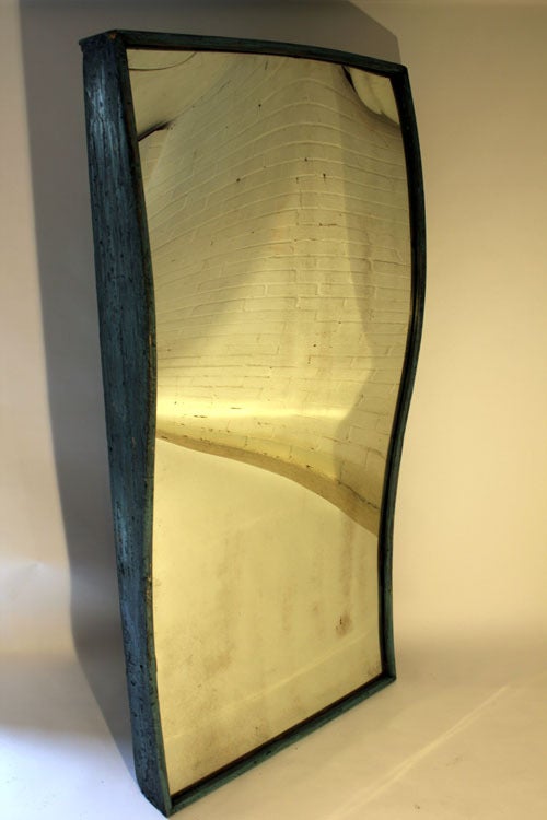 A rare and very large Victorian fairground mirror with orginal curved glass plate and wooden painted frame and orginal back boards.
