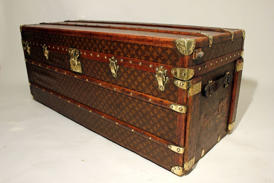 A very large Louis Vuitton wardrobe trunk in a fine monogram patterned canvas, leather and all brass trimmed with leather handles, brass locks and studs.  In very good original condition.