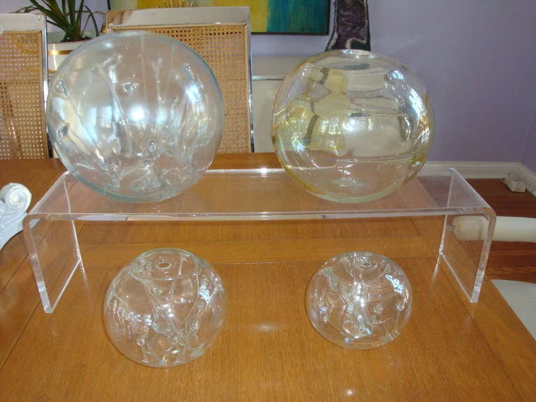 Up for sale are a group of 3 handblown art glass spheres by Peter Bra Hall American, born 1942 from 1970s All spheres signed and dated.