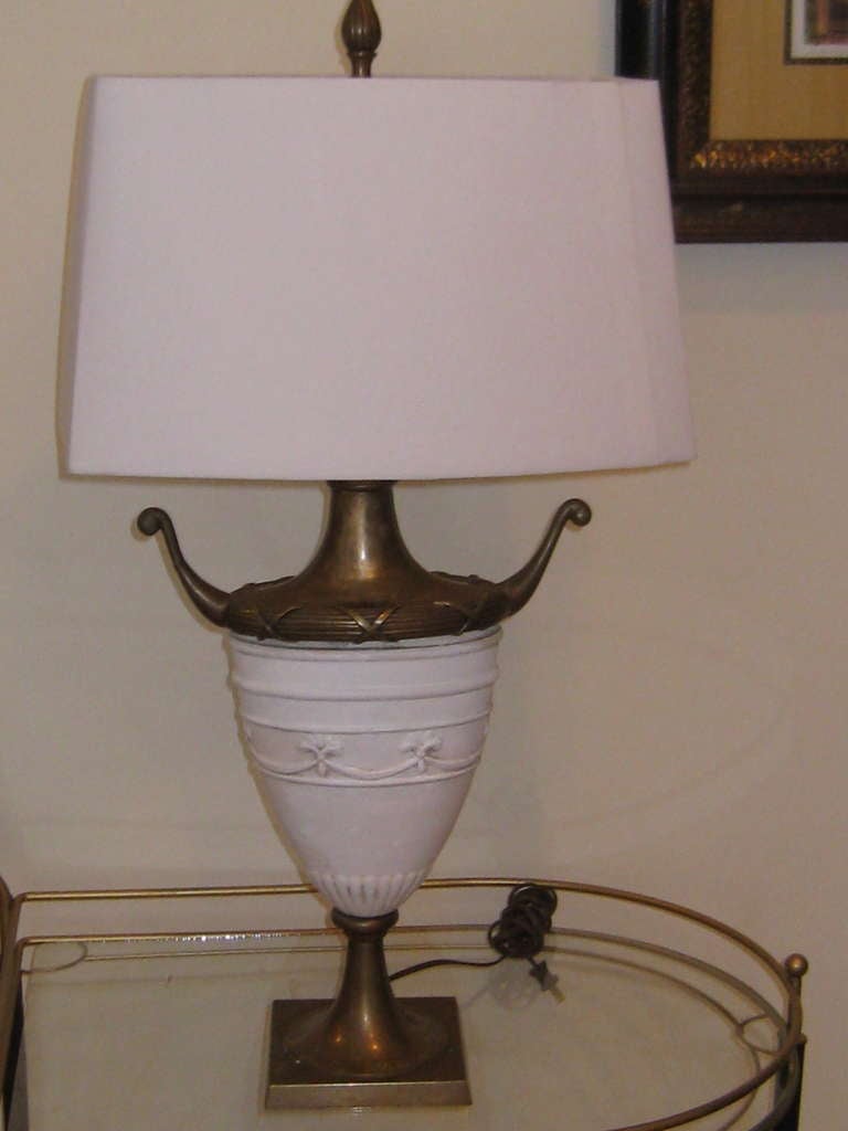 A pair of Chapman ceramic and brass Neo-classical style table lamps.