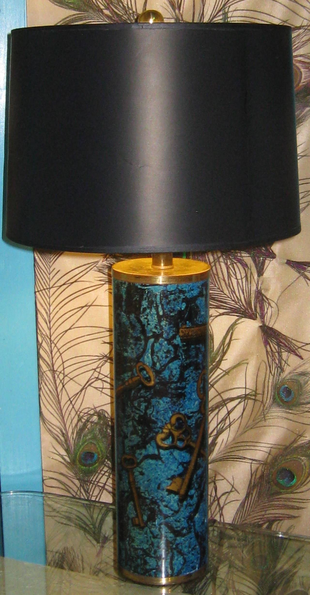 Italian mid-20th century ceramic lamp with transfer key design in the style of Piero Fornasetti. Original paper label on the underside. Fabulous turquoise color.