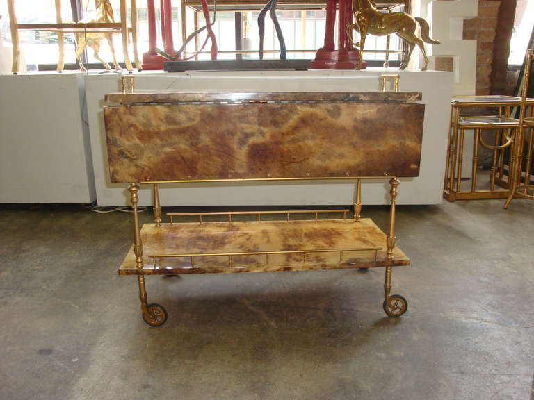 This is a midcentury Goatskin Barcart by Italian maker Aldo Tura