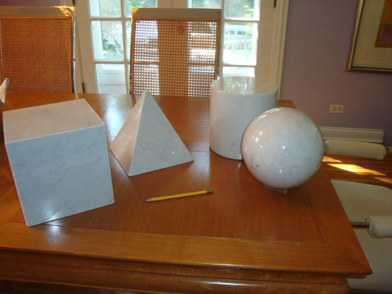 This is a set of four large marble geometric pieces from 1980s.