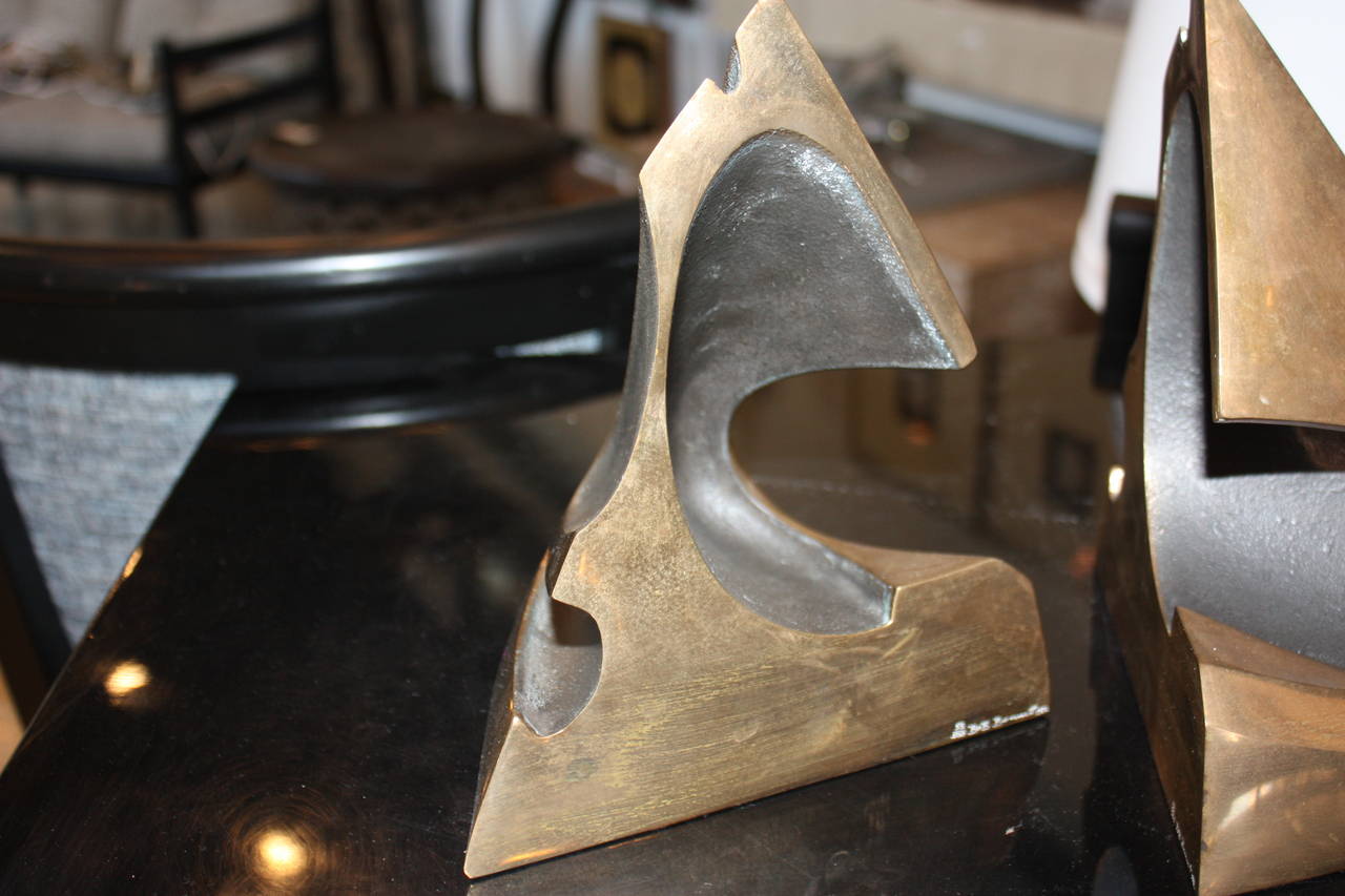 Free form bronze bookends with black painted accents  signed and numbered.
53/500  dated 1987
Each bookend is 8.5H x 7D x 6W