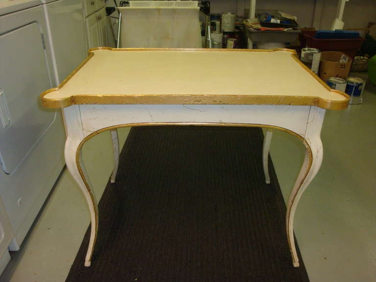 This is a 1950s-1960s distressed painted wood bodart desk.