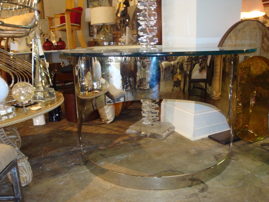 Pair of chic polished stainless steel and glass console tables by Paul M. Jones, New York.