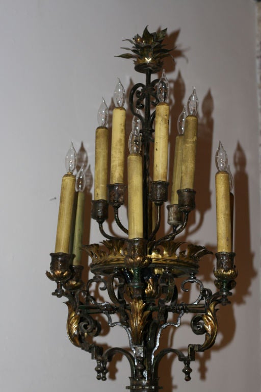 From a Montecito estate, this incredibly fine and rare pair of early 20th c. wrought iron torchieres exhibit 12 lights and highly detailed craftsmanship. Very heavy and extremely well executed, they are the height of Spanish Revival style. With many