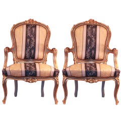 A Pair of Gilt Wood Italian or French Rococo Armchairs