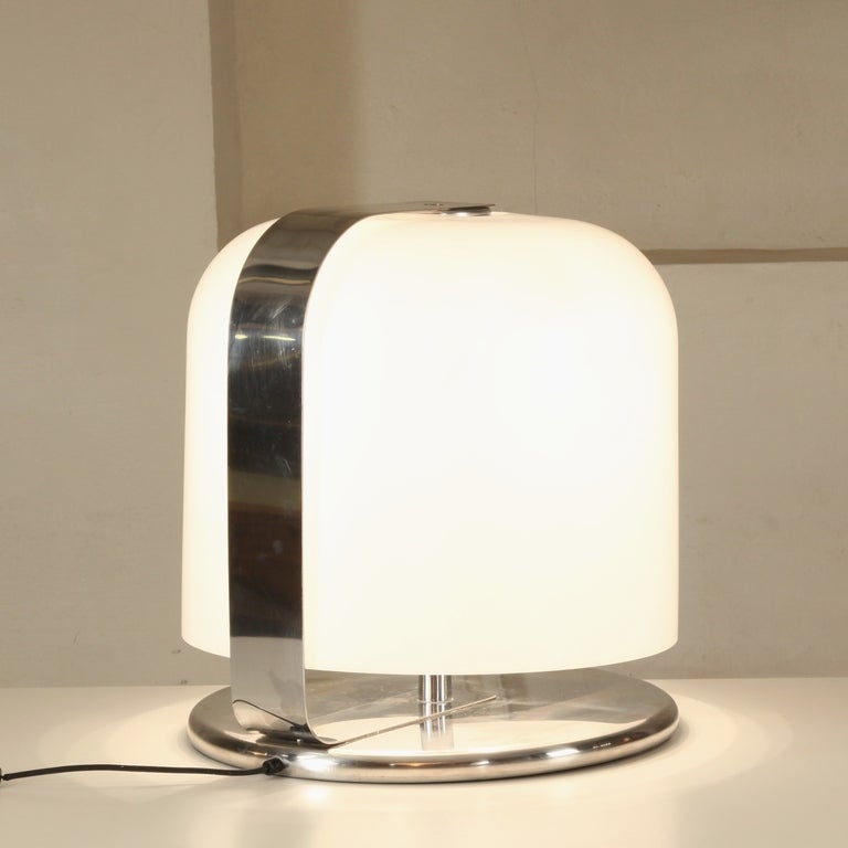 1966's 'Alvise' table lamp designed by Luigi Massoni produced by Guzzuni.
 
White plastic shade and chrome metal structure.On-off switch.
 
The lamp is in fab. condition and is out of production since the 1970's.
Can be used as big tablelamp or