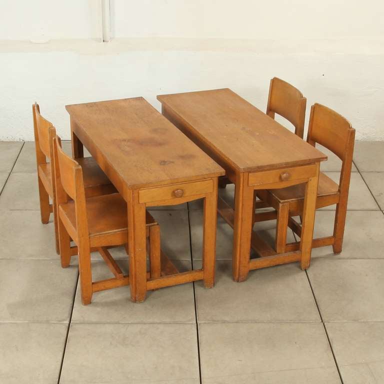 These  desks and matching chairs (seatingheight=34 cm) are  important and extremely rare pieces. It is among the earliest pieces of furniture designed in the 1930's by the founder of Dox Lier and a set  of very few examples from that period which