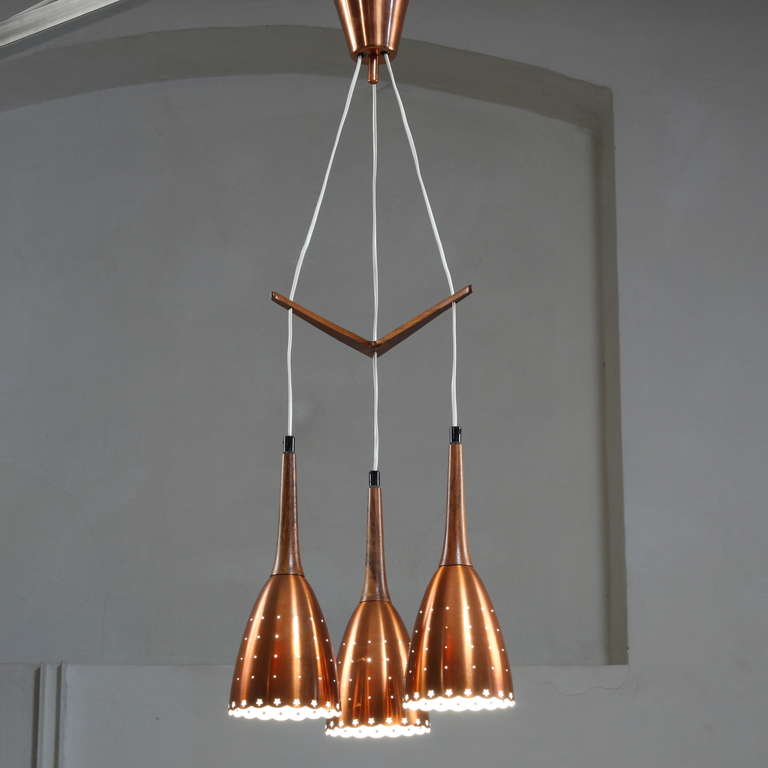 Mid-20th Century Impressive Copper Chandelier With Performated Shades And Tropic Wood Details