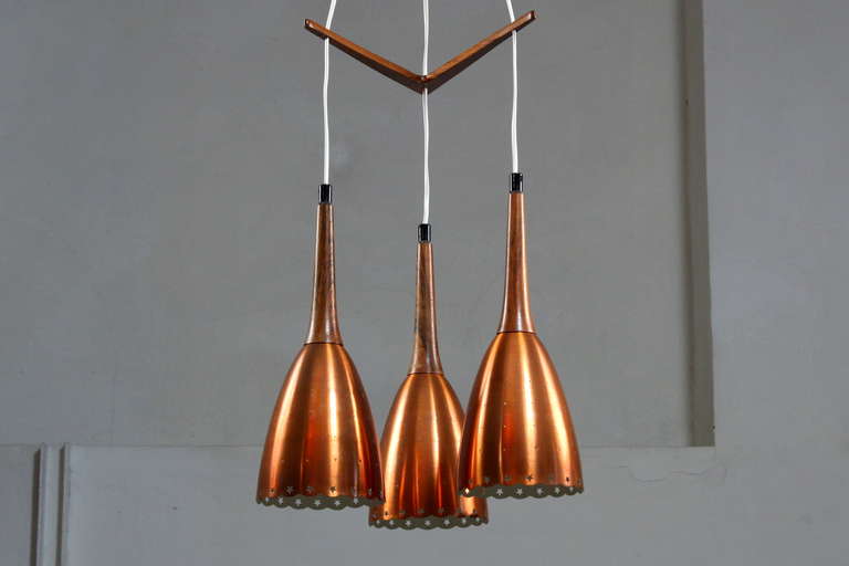 Impressive Copper Chandelier With Performated Shades And Tropic Wood Details 1