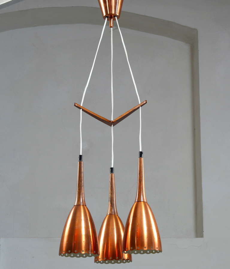 Impressive Copper Chandelier With Performated Shades And Tropic Wood Details 2