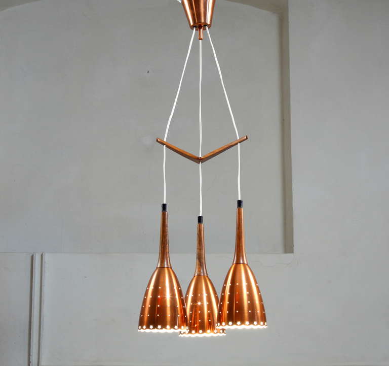Impressive Copper Chandelier With Performated Shades And Tropic Wood Details 3