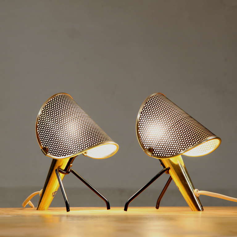 Charming Mid Century bed stand lamps.  Brass frame and orientable shades.  Beautiful detailed pair of lamps.