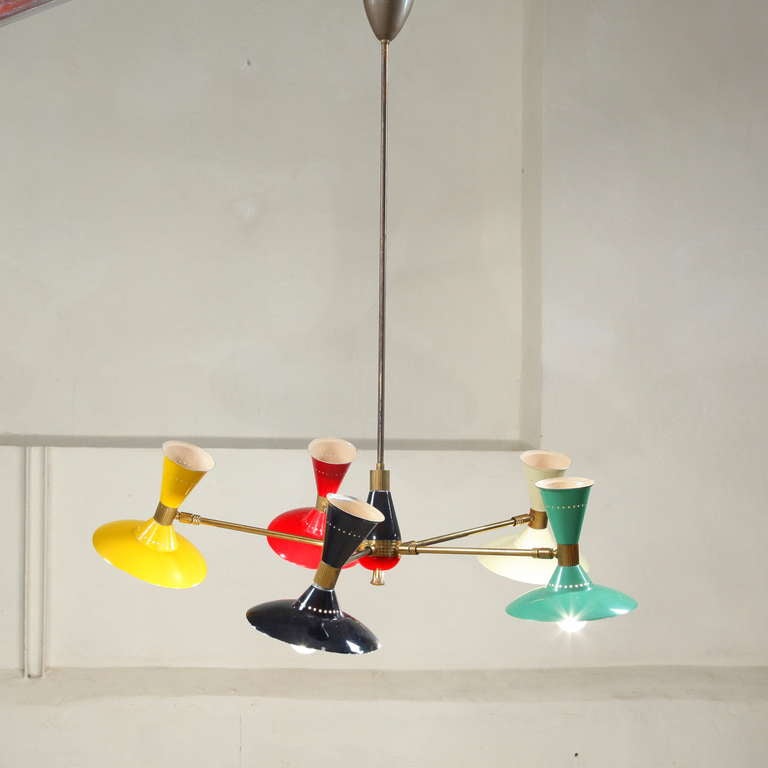Stunning 100% original XL Stilnovo chandelier 1950's.
Rexired and all Original colourful lacqueres shades.
Beautifull combinations of colours and brass details.
Shades hold 2 bulbs each and can be orientated in all direction +180° up and down.