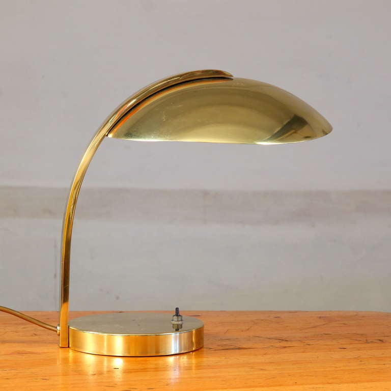 High end luxury all brass table lamp.  All brass and metal feet  on-off switch.  No dents and a real masterpiece on any desk or sideboard.