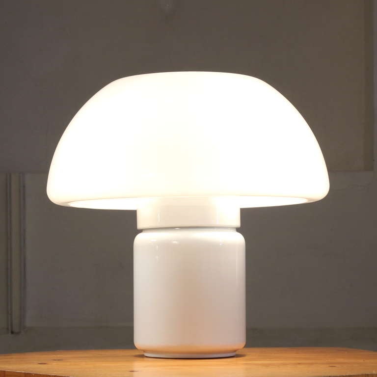 XL 1960's mushroom lamp design Elio Martinelli for Martinelli Luce.
Heavy metal base with plastic shade.  3 lightbulbs under the shade.
Good condition and can be used as table/floor lamp.