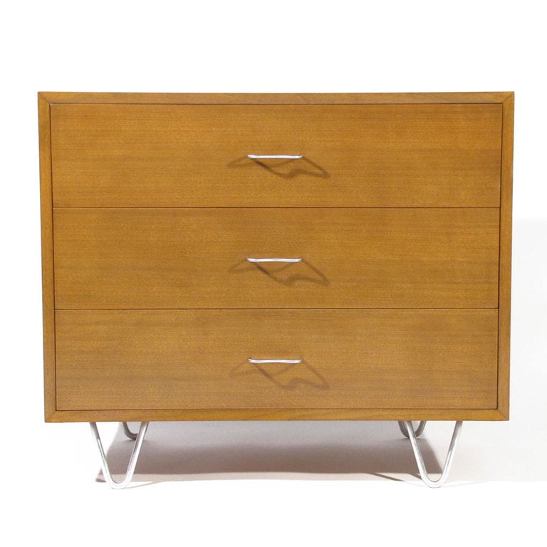 Handsome George Nelson for Herman Miller Model 4600 three drawer dresser in walnut with satin aluminum hairpin legs and satin chrome M pulls. Foil George Nelson/Herman Miller label affixed. 

Overall excellent original condition. Please call