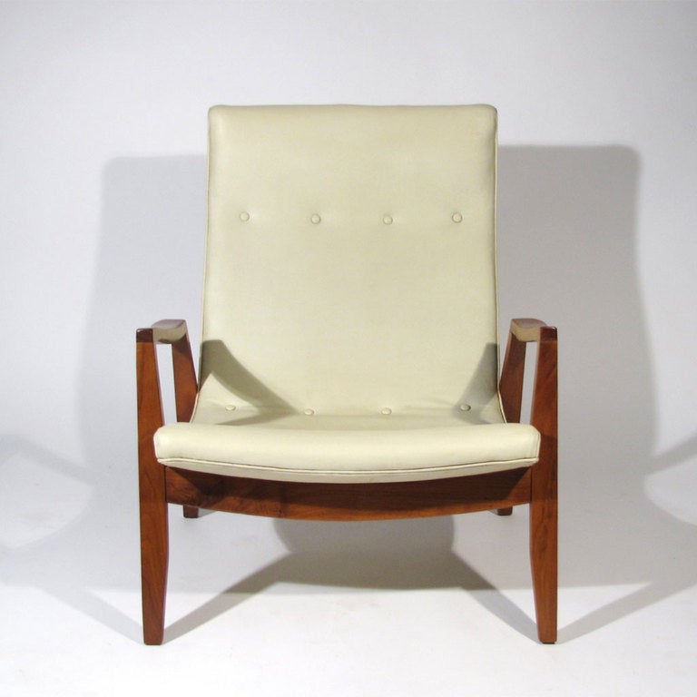 Handsome Milo Baughman for Thayer Coggin lounge chair. Walnut frame supports very comfortable scoop seat, upholstered in original ivory tufted leatherette. 

Restored frame. Upholstery good. Please call Eddy at 410.299.9147 for detailed condition
