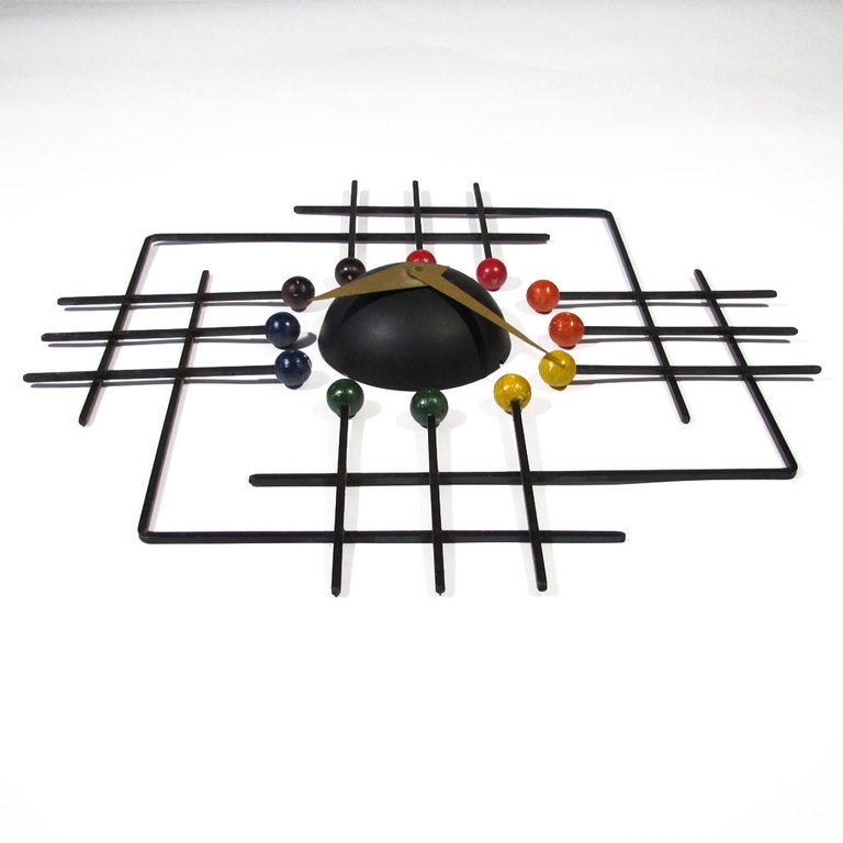 Exceedingly rare square grid form Frederick Weinberg ball clock. Welded iron pattern with red, yellow, blue, and yellow balls. We have left this clock in its original state for the purist, but we will aid in professional restoration of minor paint