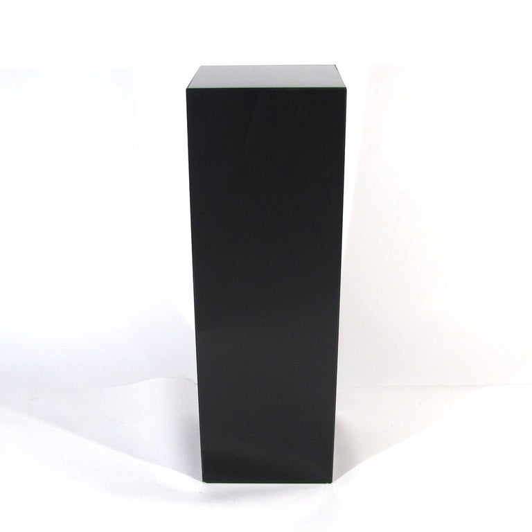 Minimalistic Art Deco Carrara glass pedestal. Thick black period carrara glass with ribbed interior. Black carrara glass appears very deep purple when applied to direct light source, so lighting interior would produce a nice affect.

Overall