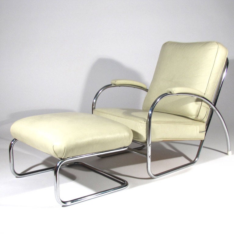 Art Deco Machine Age chair and ottoman designed by Wolfgang Hoffman for Howell. Heavy tubular chrome frames with original spring core wrapped cotton cushions in ivory leather upholstery. From the Gilbert Rohde, Wolfgang Hoffman, and KEM Weber era of