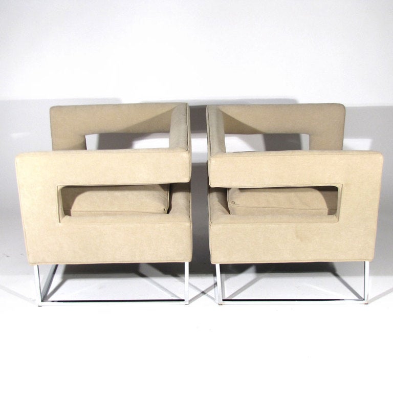 Pair striking Milo Baughman cantilever form club chairs. Newly upholstered in soft taupe with chrome bases. Very comfortable.

Overall excellent condition. New upholstery. Walnut frames refinished. Please call Eddy at 410.299.9147 for detailed