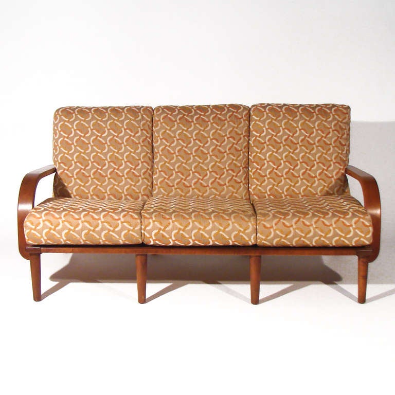 Hard-to-find Conant Ball sofa. Attributed to their earlier Russel Wright designs. Made of maple bentwood. Extremely comfortable. In gently restored original condition. The fabric is vintage though not original -in good condition and looks great with