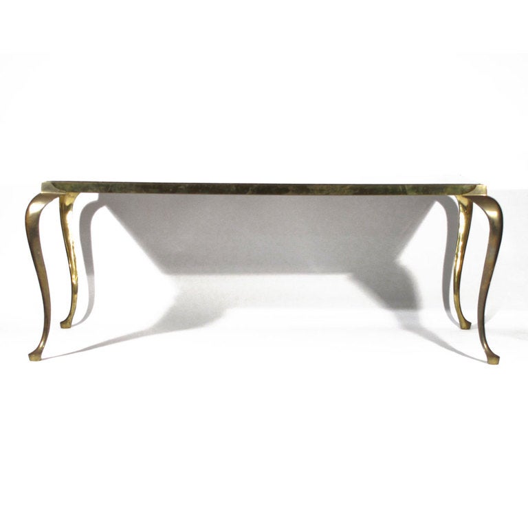Graceful Italian marble and brass dining room table. Beautiful long patinated brass cabriole legs and and skirt. Olive marble with sand veins. Looks wonderful with patina, but we will have brass professionally polished and lacquered if you prefer