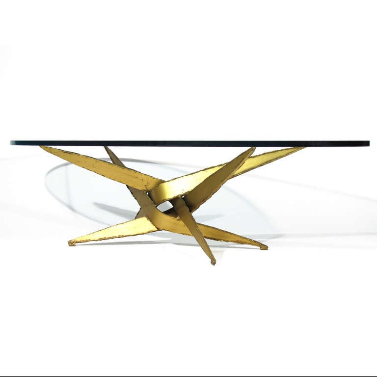 Welded heavy gauge steel coffee table with intense brutal form by Silas Seandel. Sword form bolts of rough edged torch cut steel entangle to form a dramatic base, with broad .75