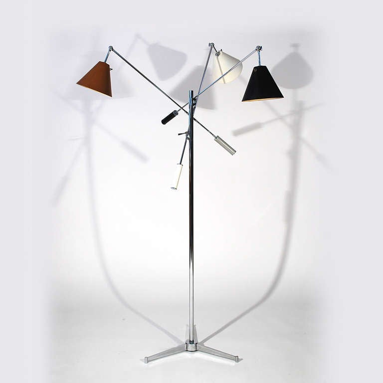 Gino Sarfatti for Arteluce Triennale three arm floor lamp with a chromed armature on the early version three-pronged base. It has three cone shades in black, brown and white.