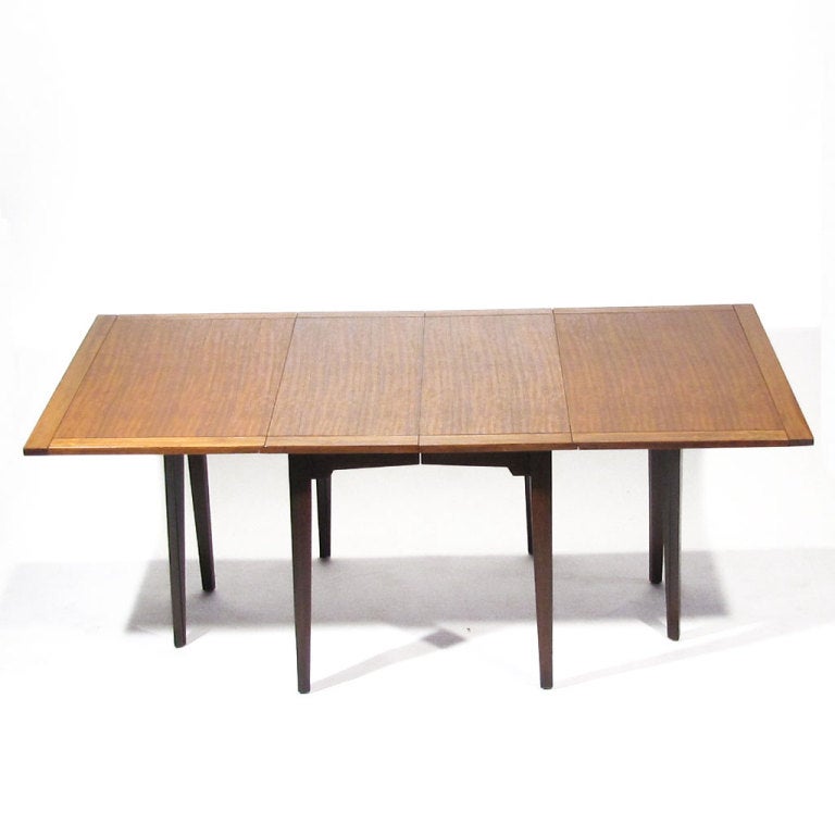 Milo Baughman dining table crafted in primavera wood with dramatic ribbon figuring. Extends from 32
