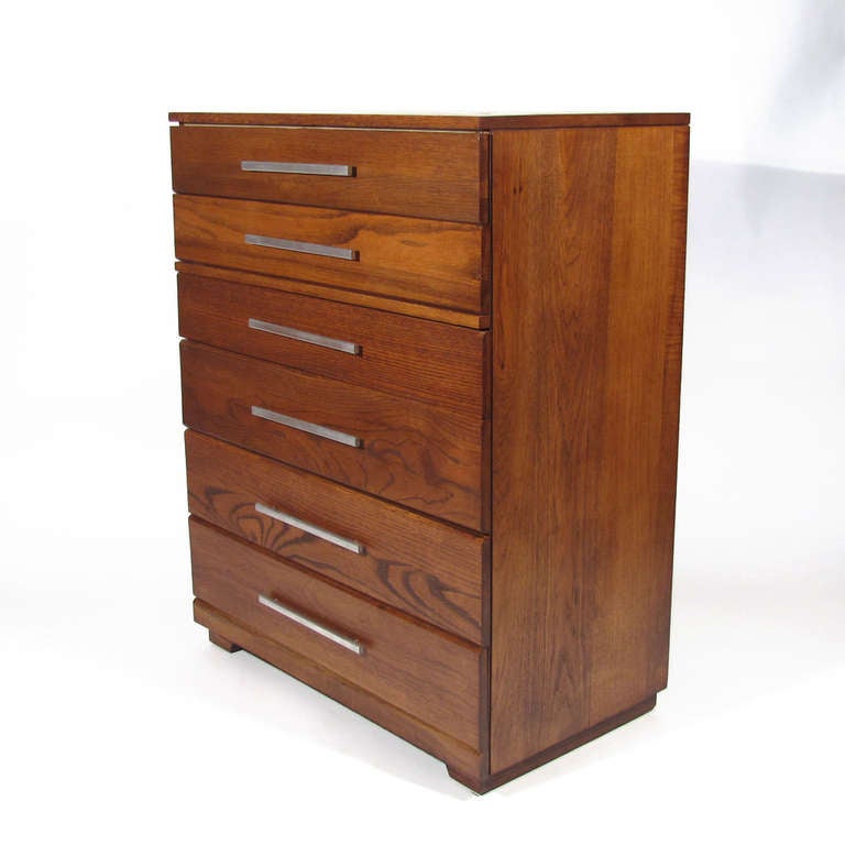 Raymond Loewy for Mengel graduated six drawer dresser with long beveled cast aluminum pulls . Well proportioned with nice figuring and color.

Overall excellent restored condition. Chestnut color with satin finish. Well crafted and heavy.