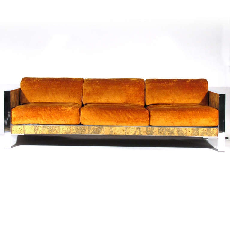 Flat bar chrome Milo Baughman sofa with intensely detailed cork panels. Upholstered in vibrant plush tangerine velvet. Exceedingly comfortable. Matching love seat available.