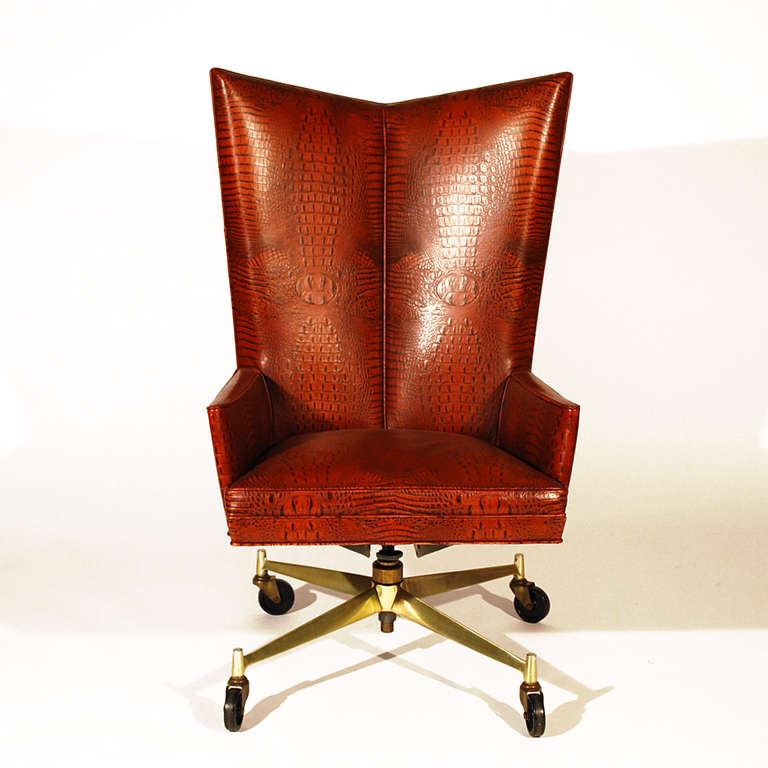 Striking Paul McCobb Executive Chair upholstered in crocodile embossed leather. Adjustable.

Recent leather upholstery. Casters glide with ease.