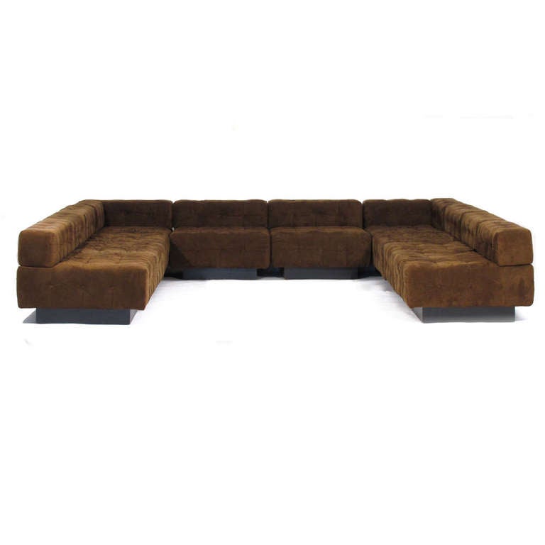 Harvey Probber ten piece tufted sectional sofa comprising eight straight and two corner sections. Most desirable design with all bases being on same dimension for many configurations. Leaving options, pricing includes upholstery in any Romo Zinc
