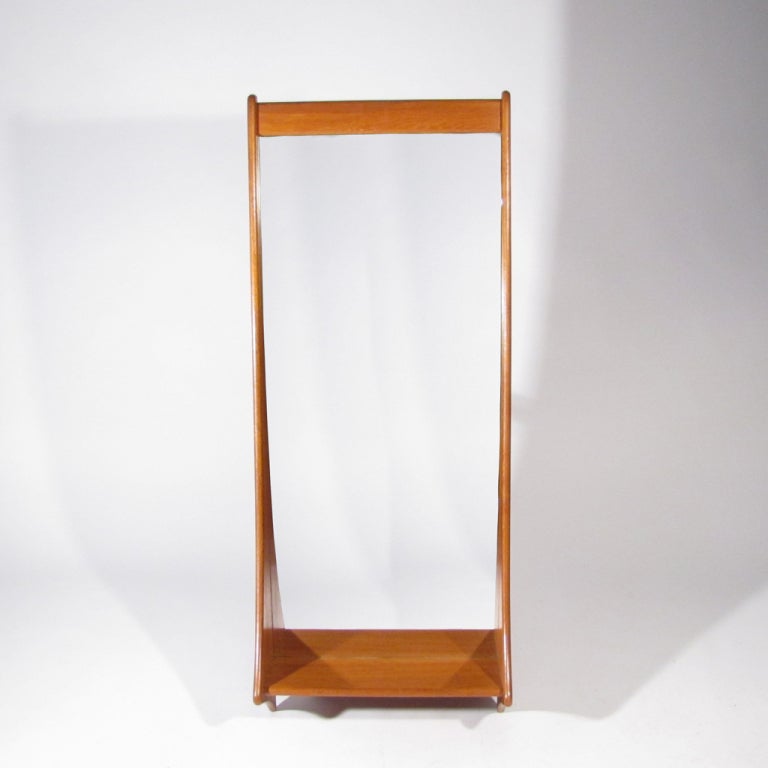 Graceful Pedersen and Hansen Danish shelved teak mirror with  fine joinery.

Restored condition. New glass.
