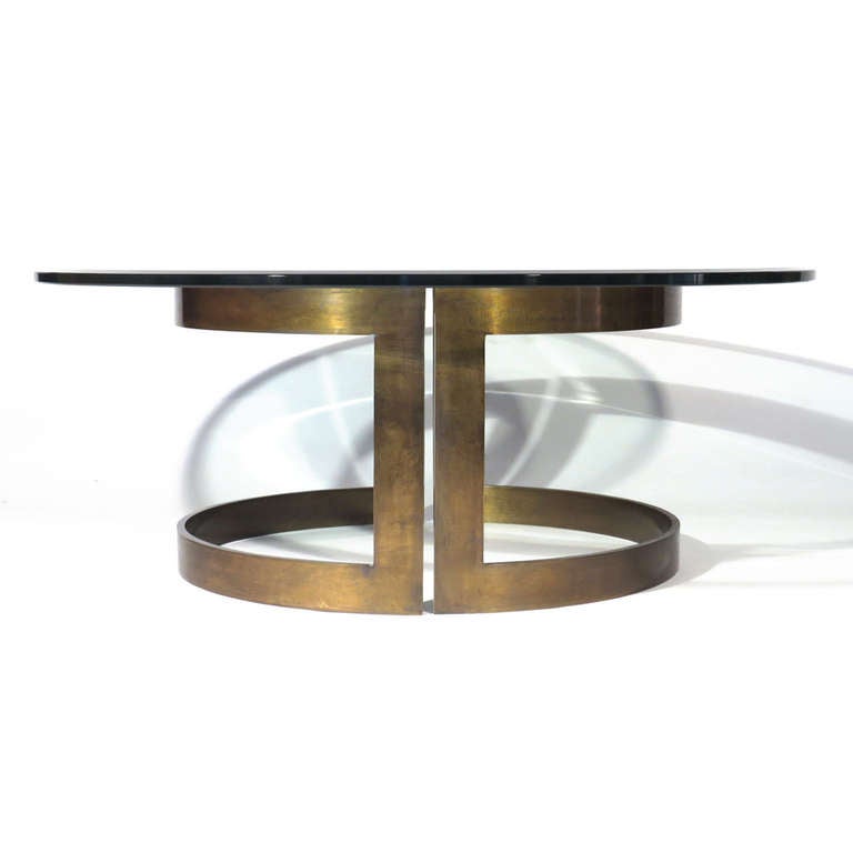 Striking Milo Baughman cantilever form solid bronze coffee table. Two identical, quite heavy, semi circular bronze sections support beveled .75