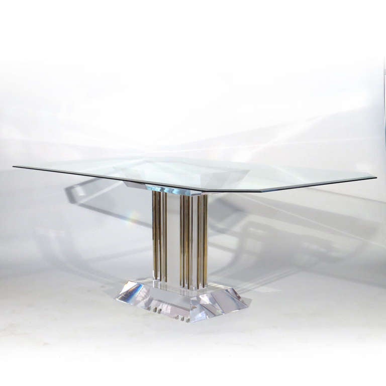 Stunning thick beveled Lucite dining table with vertical brass bars. Brass has nice patina, but we will have brass highly polished and lacquered, or chrome plated if you prefer either of these looks. Base could easily support much larger rectangular
