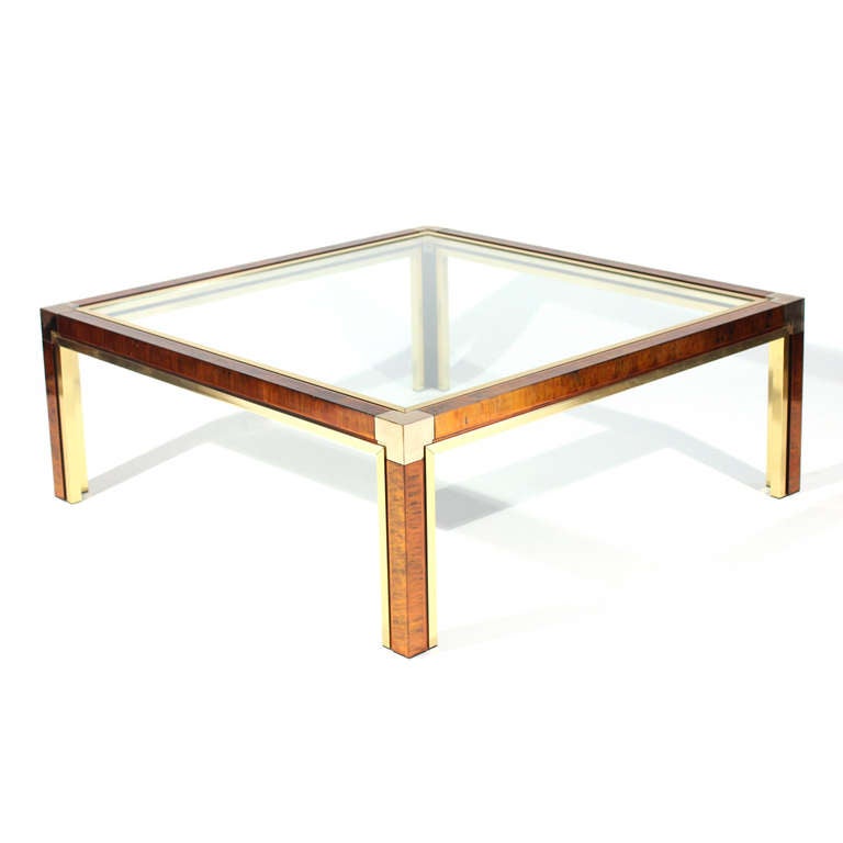 A truly stunning coffee table. Sturdy but light weight done in aluminum and brass with patinated metal faux tortoise finish. In very good vintage condition.