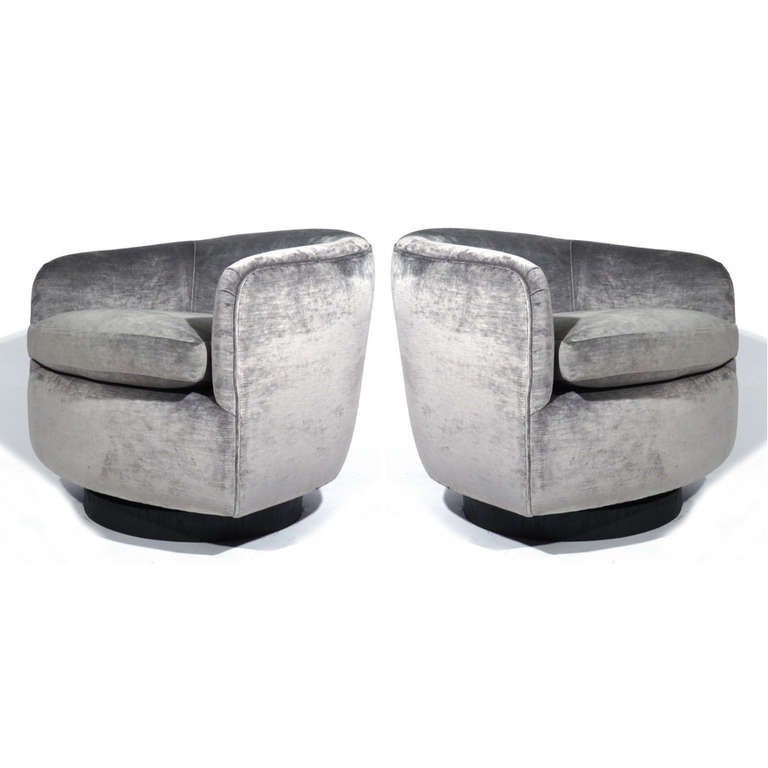 Sleek pair Milo Baughman barrel back lounge chairs upholstered in Romo Zinc Vice Tungsten. Black lacquered bases. Swivel and tilt. E-mail address for swatch.