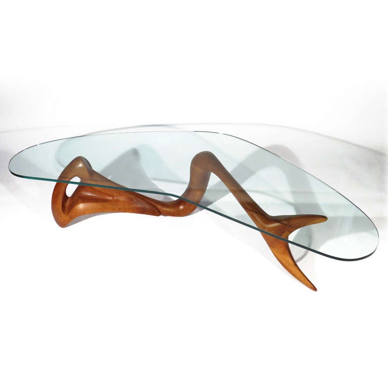 Organic abstract fish form walnut coffee table with boomerang glass top. Exceptional form and detail.