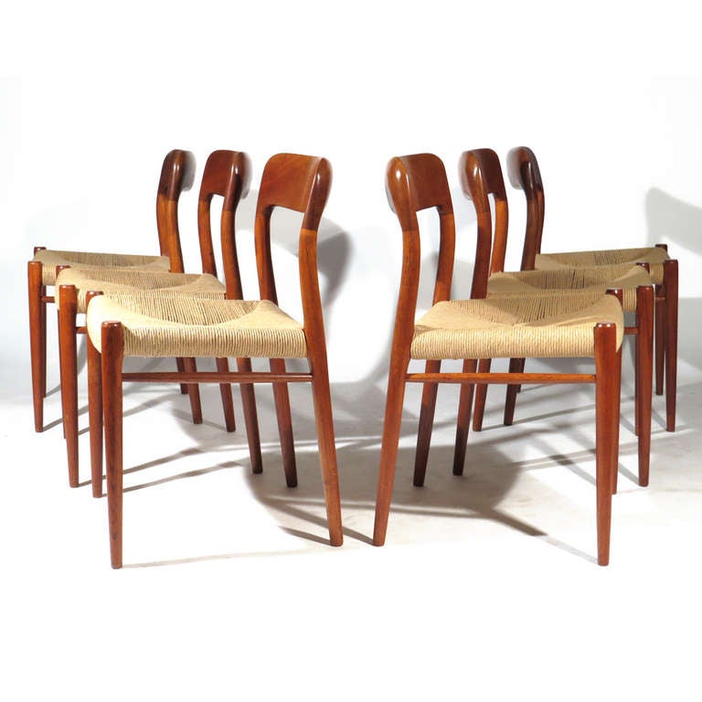 Six Moller Model 75 dining chairs in teak with new rush seats. Beautiful deep color to teak. Very comfortable with gently curved backs.

Excellent condition. New rush seats.